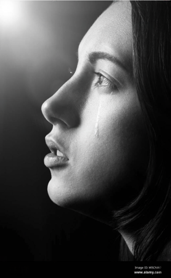 Emotional portrait photography reference photo of a sad expressive woman looking down